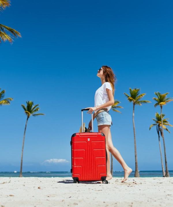 woman-with-red-suitcase-palm-island-travel-fresh-air (1)